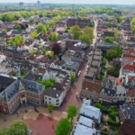 Arial view from the top of the tower of the St. Martins Cathedral at sunny day. Beautiful view of streets with ancient buildings of Utrecht. Popular travel destination in the Netherlands