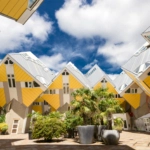 Public space under the cube houses in Rotterdam under blue sky in Summer